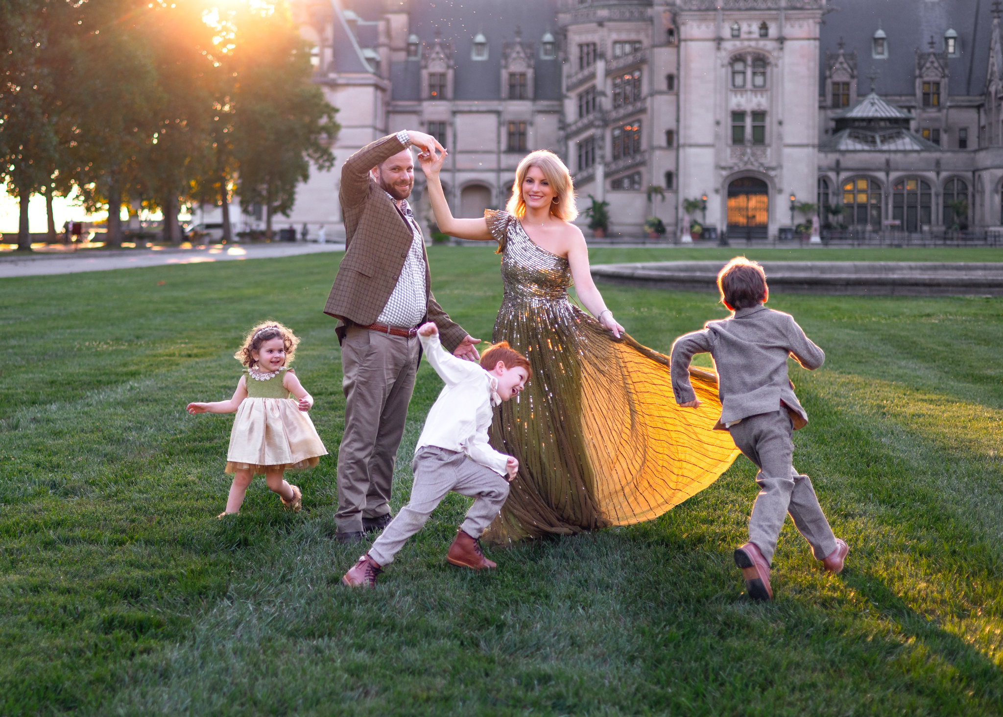 family dancing in front of the Biltmore Estates