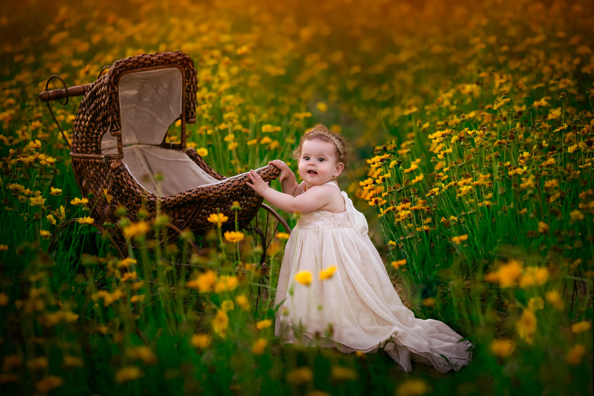 A young toddler walks through a field of yellow flowers with a wicker cradle raleigh summer camps