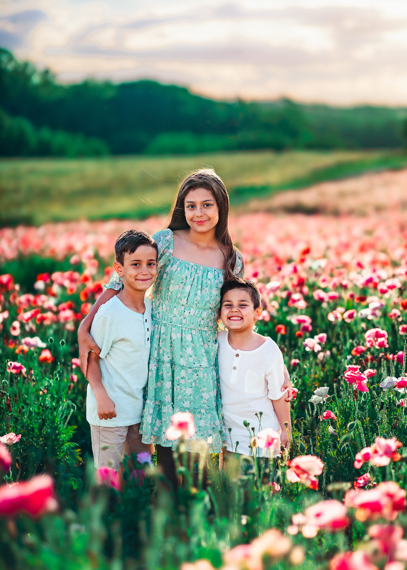 Children smiling in poppy fields at Dogwood Farms