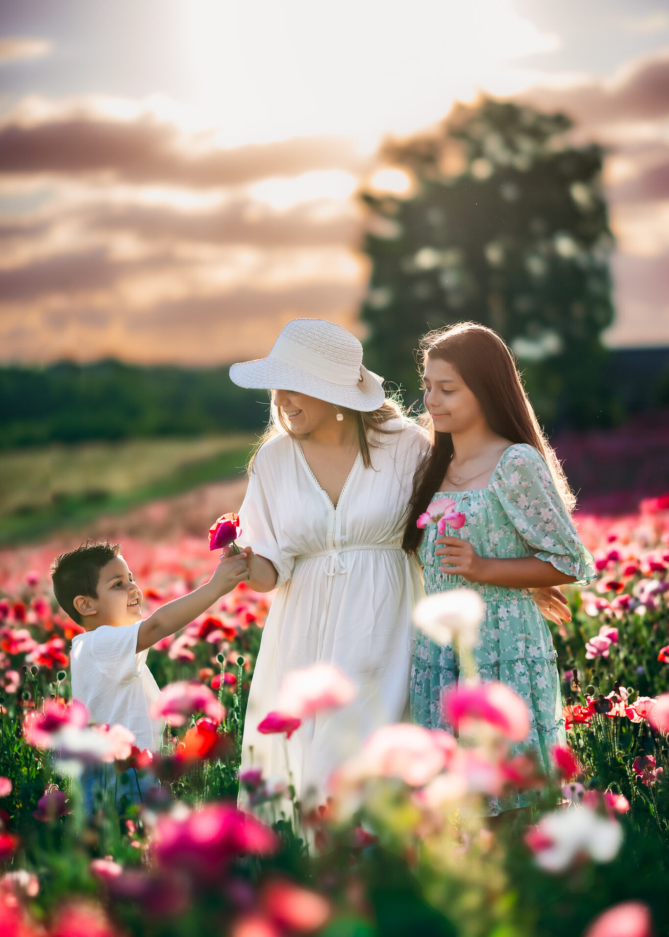 Mother and her children in the poppy fields at Dogwood Farms