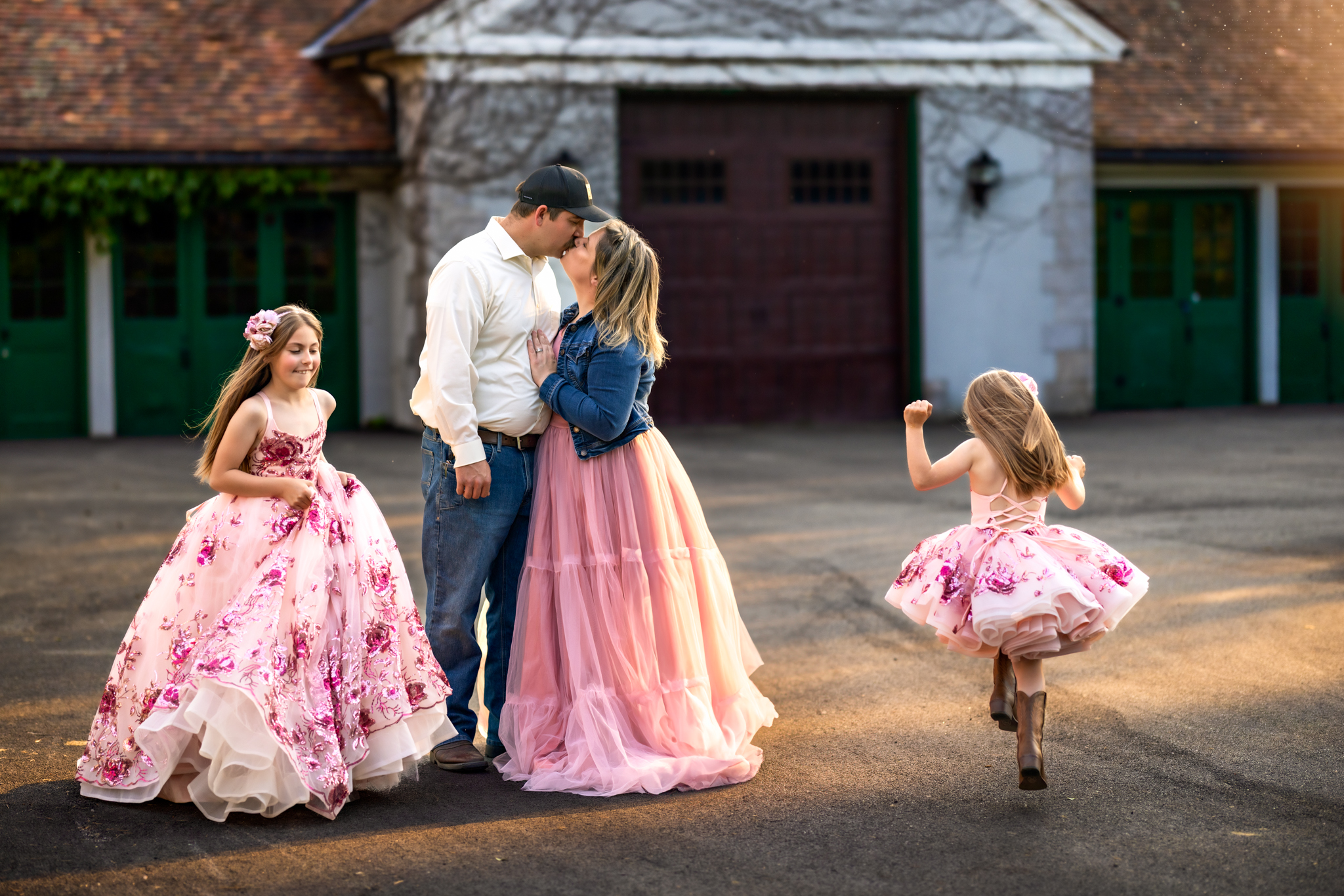 Family photo dancing in the sunset by a beautiful venue, Raleigh family photographer, wearing dresses from Little Dreamers Tutus
